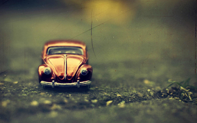 Toy car grass rocks tilt free wallpaper - medium preview image