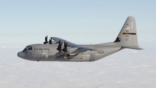 Large military plane flying above free wallpaper - medium preview image