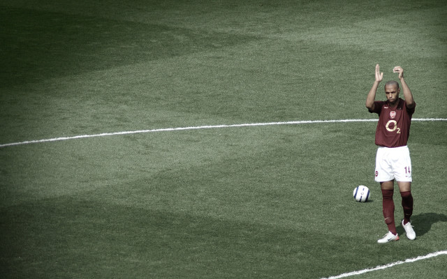 Man standing soccer field hands free wallpaper - medium preview image