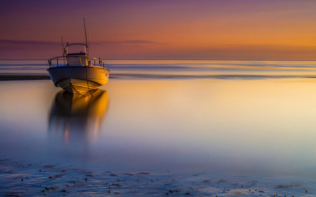 Boat shore beach sunset ocean free wallpaper - medium preview image