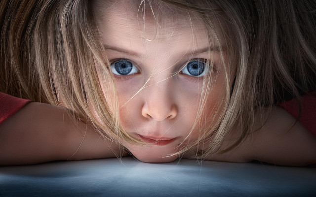 Young girl blue eyes serious #2 free wallpaper - medium preview image