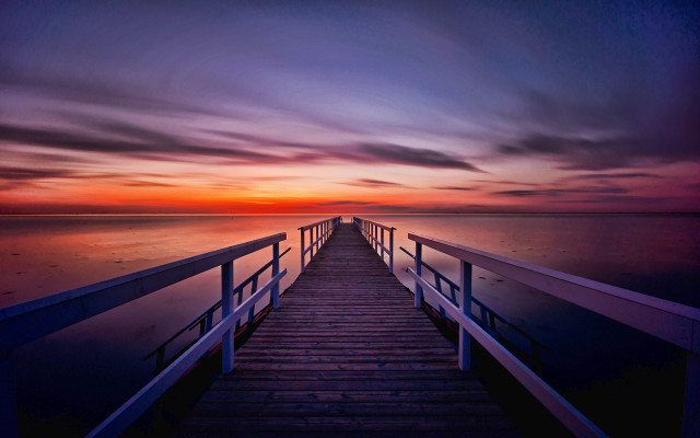 Sunset pier mountain ocean water free wallpaper - medium preview image