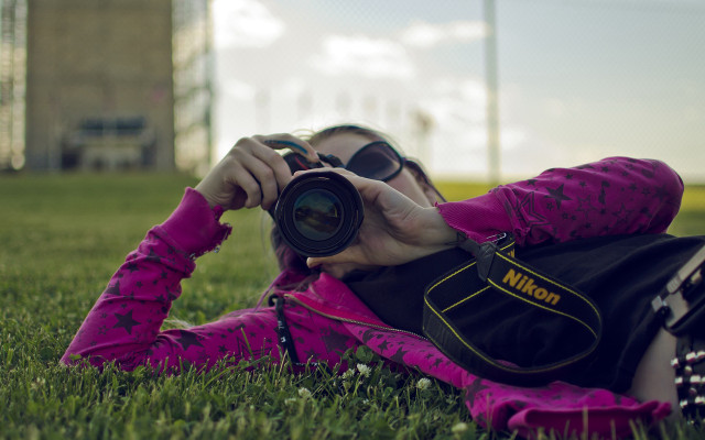 Woman grass camera lens building free wallpaper - medium preview image