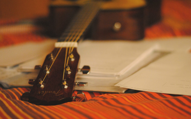 Guitar bed notepad pen background free wallpaper - medium preview image