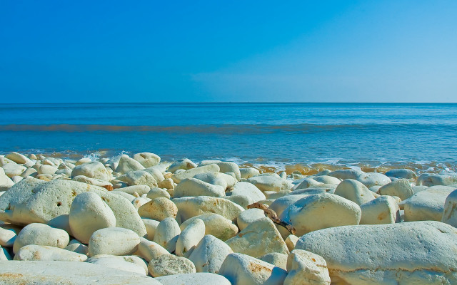 Rocky beach water sky island free wallpaper - medium preview image