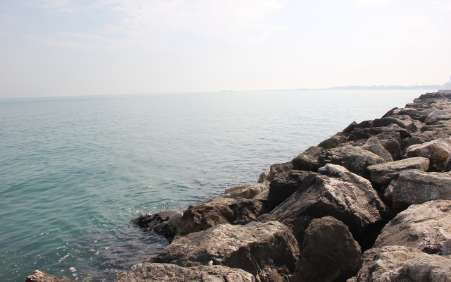 Rocky shore lake clouds mountains free wallpaper - medium preview image