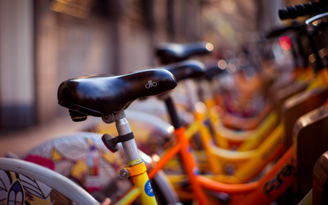 Bicycles sidewalk building blurry shallow free wallpaper - medium preview image