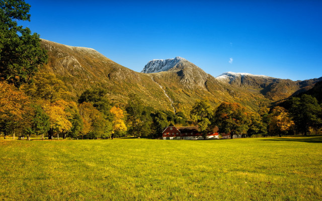 Grassy field house mountains snow free wallpaper - medium preview image