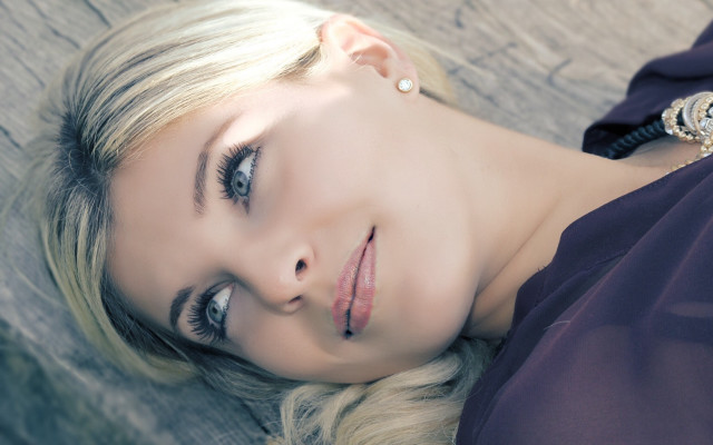 Blond woman purple dress laying free wallpaper - medium preview image