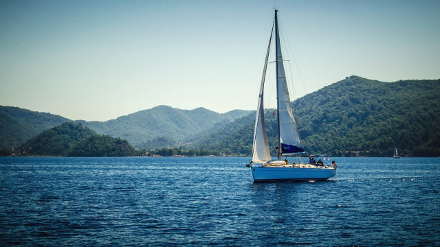 Sailboat lake mountains blue sky free wallpaper - medium preview image