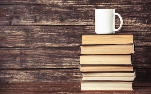 Stack books mug wooden table free wallpaper - medium preview image