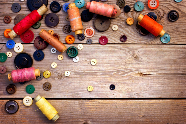 Wooden table colored spools buttons free wallpaper - medium preview image