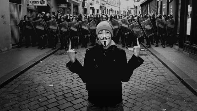 Masked crowd graffiti rooftop monochrome free wallpaper - medium preview image