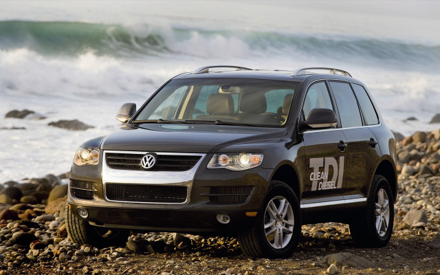 Black suv rocky beach ocean free wallpaper - medium preview image
