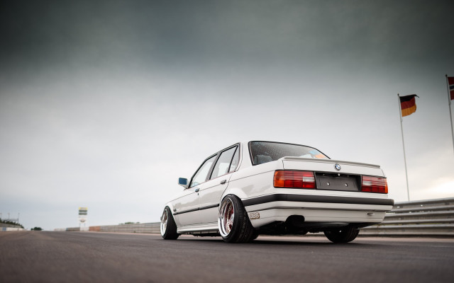 White car flag pole cloudy free wallpaper - medium preview image