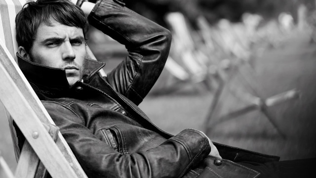 Man sitting leather jacket black free wallpaper - medium preview image