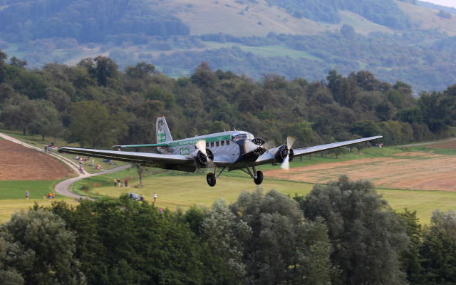 Small plane green field mountain free wallpaper - medium preview image