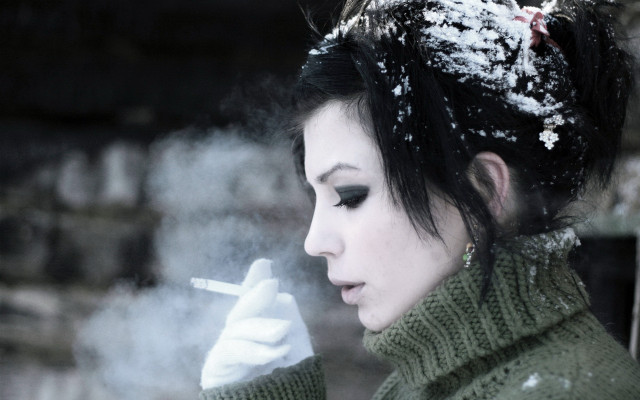 Woman smoking snow green sweater free wallpaper - medium preview image