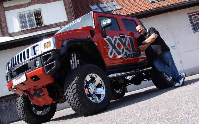 Man red truck monster tire free wallpaper - medium preview image