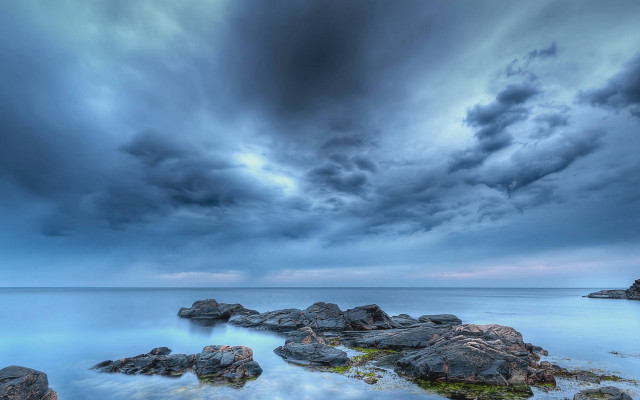 Stormy cloudy sky rocky shore free wallpaper - medium preview image