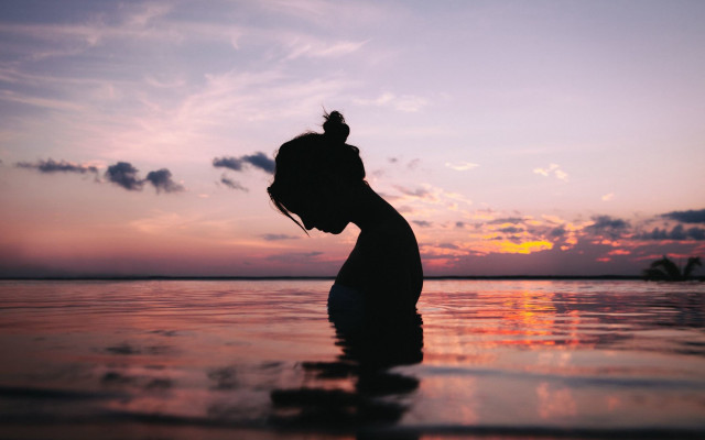 Woman water sunset silhouette tranquil free wallpaper - medium preview image