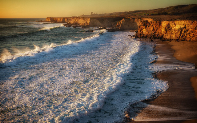 Beach waves cliffs sunset person free wallpaper - medium preview image