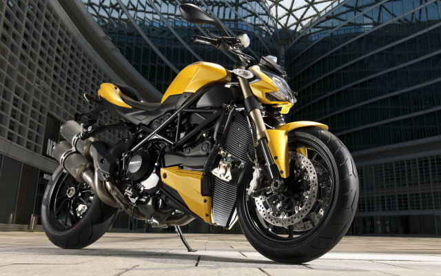 Yellow motorcycle building sky glass #2 free wallpaper - medium preview image