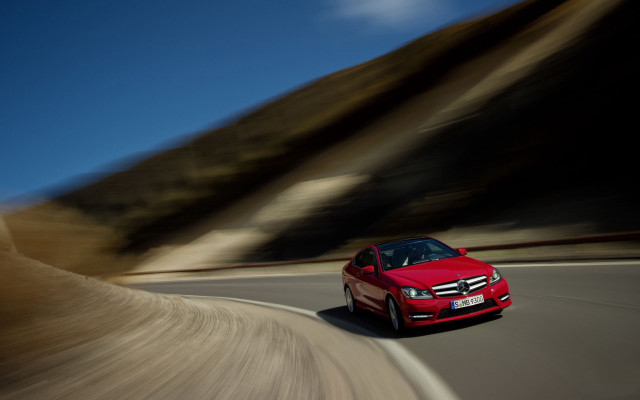 Red car mountain road blue free wallpaper - medium preview image