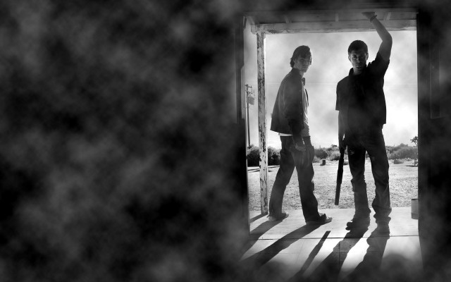 Two men doorway arms gun free wallpaper - medium preview image