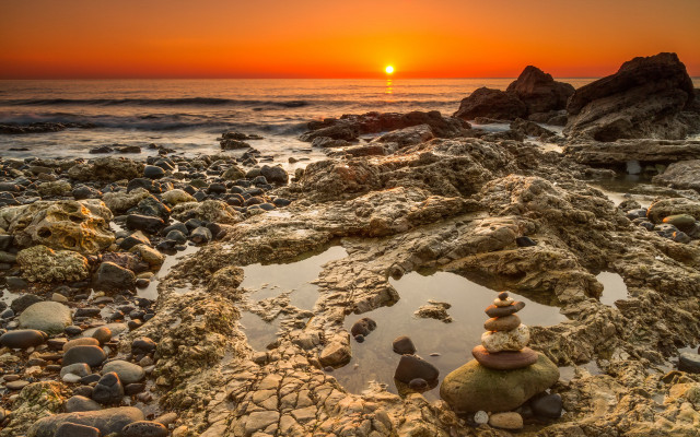 Sunset rocks water landscape symmetry free wallpaper - medium preview image