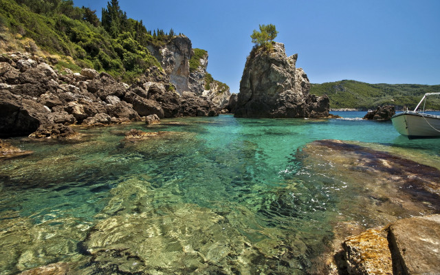 Boat rocky shore mountain lake free wallpaper - medium preview image