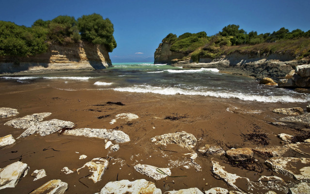 Rocky beach trees water cliff free wallpaper - medium preview image
