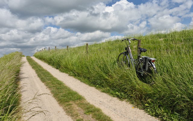 Bike fence grass dirt road #2 free wallpaper - medium preview image