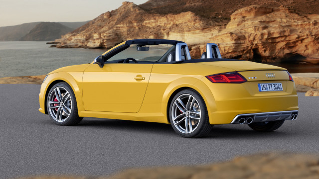 Yellow convertible cliff side road free wallpaper - medium preview image