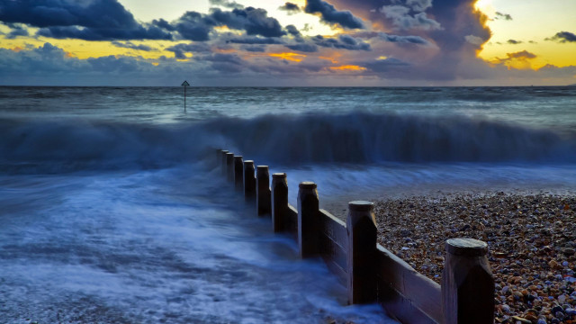 Wave fence beach sunset lighthouse free wallpaper - medium preview image