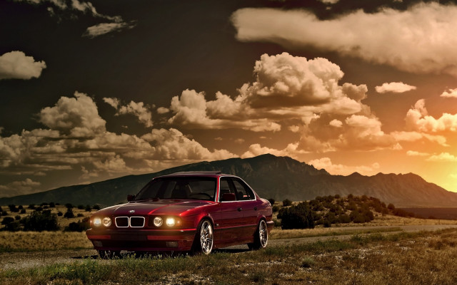 Red car mountain sunset clouds free wallpaper - medium preview image