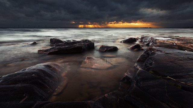 Sunset water rocks crepuscular rays free wallpaper - medium preview image