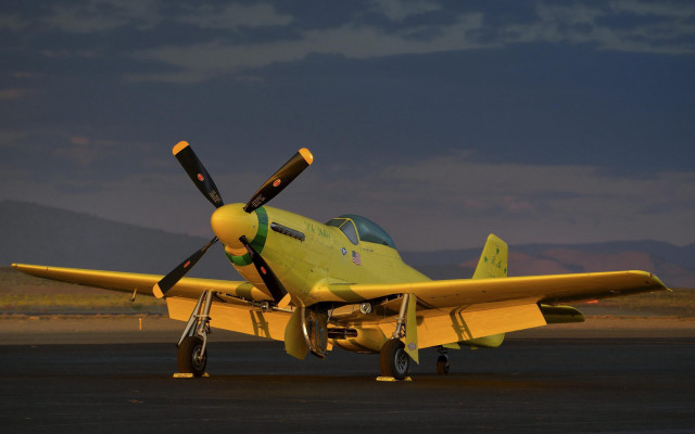 Yellow airplane runway mountains dusk free wallpaper - medium preview image