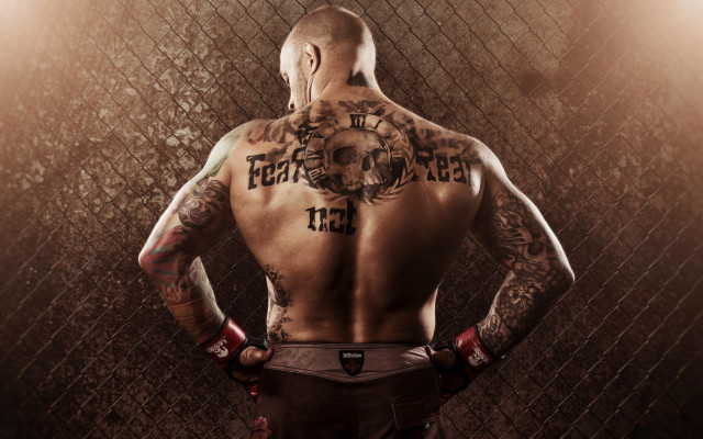 Man tattoo back fence hands free wallpaper - medium preview image