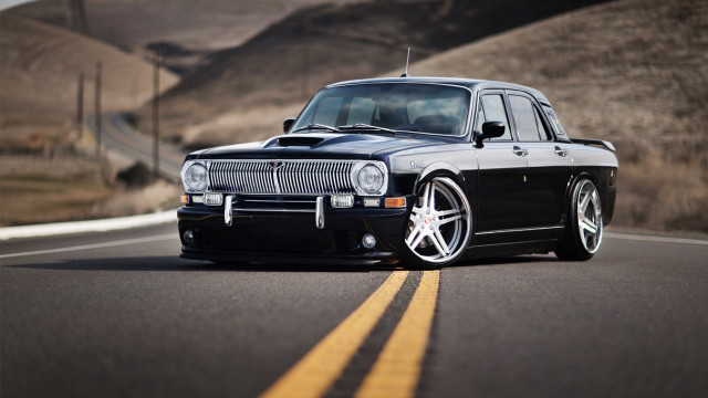 Black car country side hill free wallpaper - medium preview image