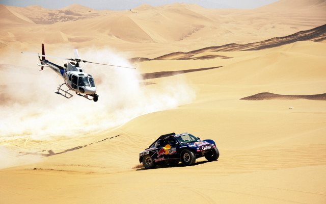 Helicopter over desert car action free wallpaper - medium preview image
