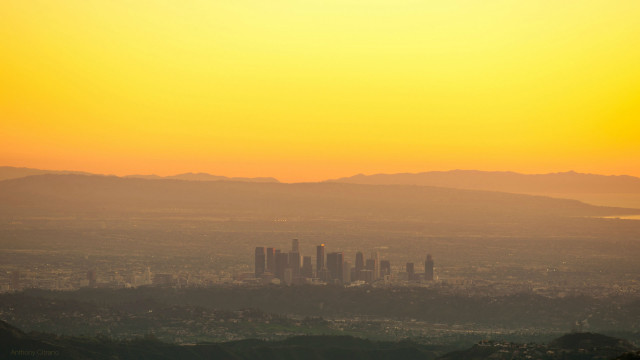 City skyline mountains dusk hazy free wallpaper - medium preview image