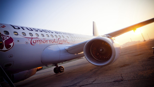 Large jetliner sunset tarmac wing free wallpaper - medium preview image