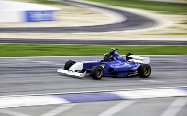 Blue white racecar driving track free wallpaper - medium preview image