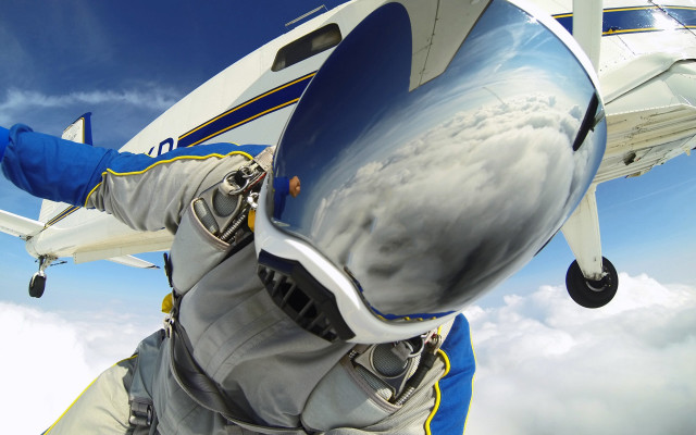 Man space suit flying plane free wallpaper - medium preview image