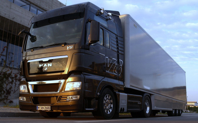Large truck building clouds sky free wallpaper - medium preview image