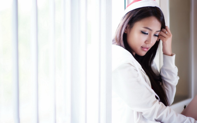 Woman santa hat smile window #2 free wallpaper - medium preview image