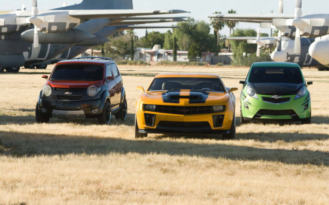 Cars plane field mountain tiltshift free wallpaper - medium preview image
