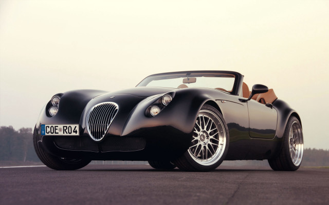 Black sports car forest sky free wallpaper - medium preview image