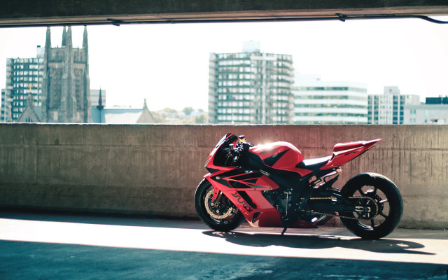 Red motorcycle cityscape tiltshift photorealism free wallpaper - medium preview image